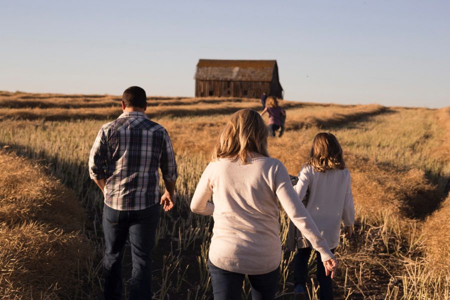 family walking in open field